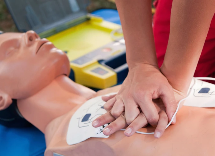 Mannequin being resuscitated during CPR training session