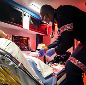 Medic treating a patient in an air ambulance