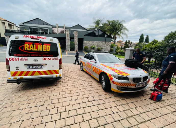 Paramedics with ambulance and response car prepared for emergencies